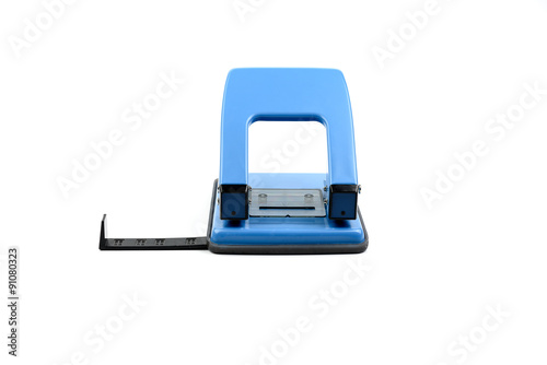 Принти на полотні Blue office paper hole puncher on white background