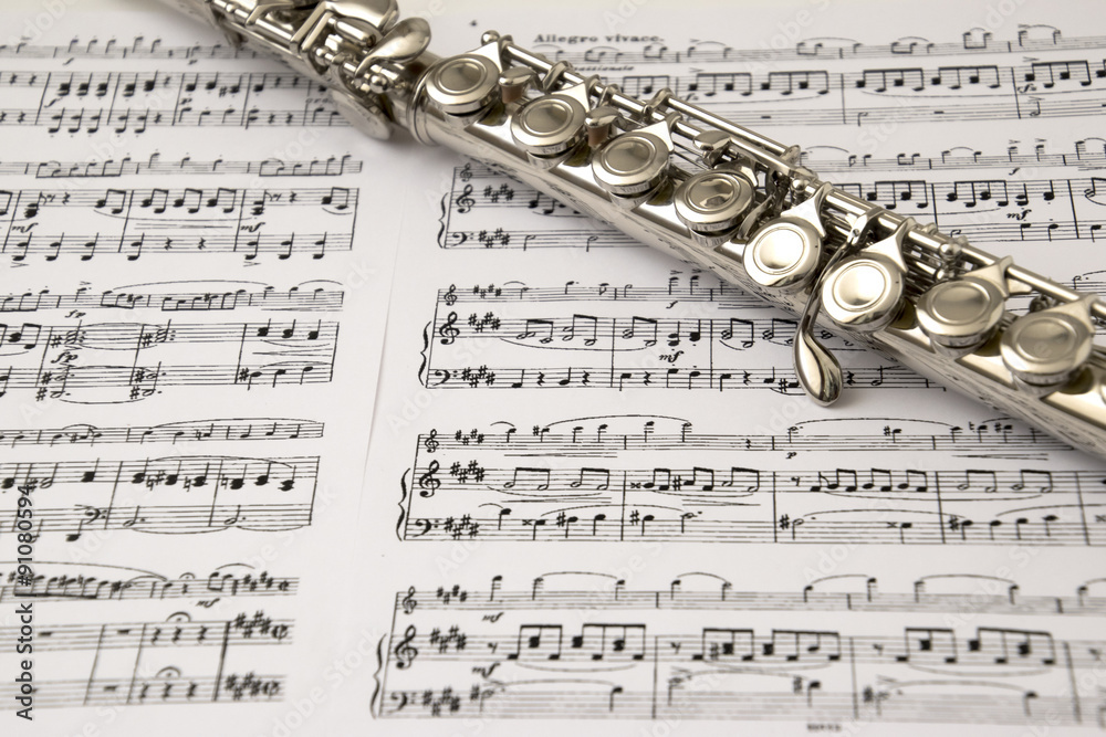 Flute on flute score background Stock Photo | Adobe Stock