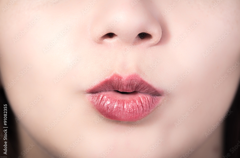 Fototapeta premium Closeup of pretty young girl's mouth