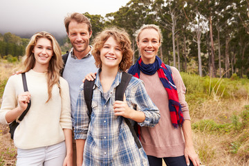 Happy family outdoor portrait in a forest