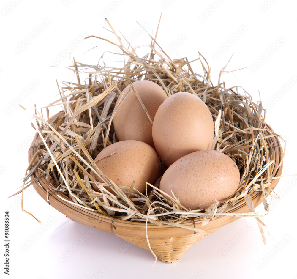 Egg,basket,straw on white background. Egg,basket,straw on white background.
