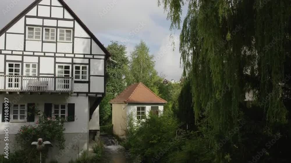 Slow motion panning shot of traditional house at river / Ulm, Germany Slow motion panning shot of traditional house at river / Ulm, Germany
