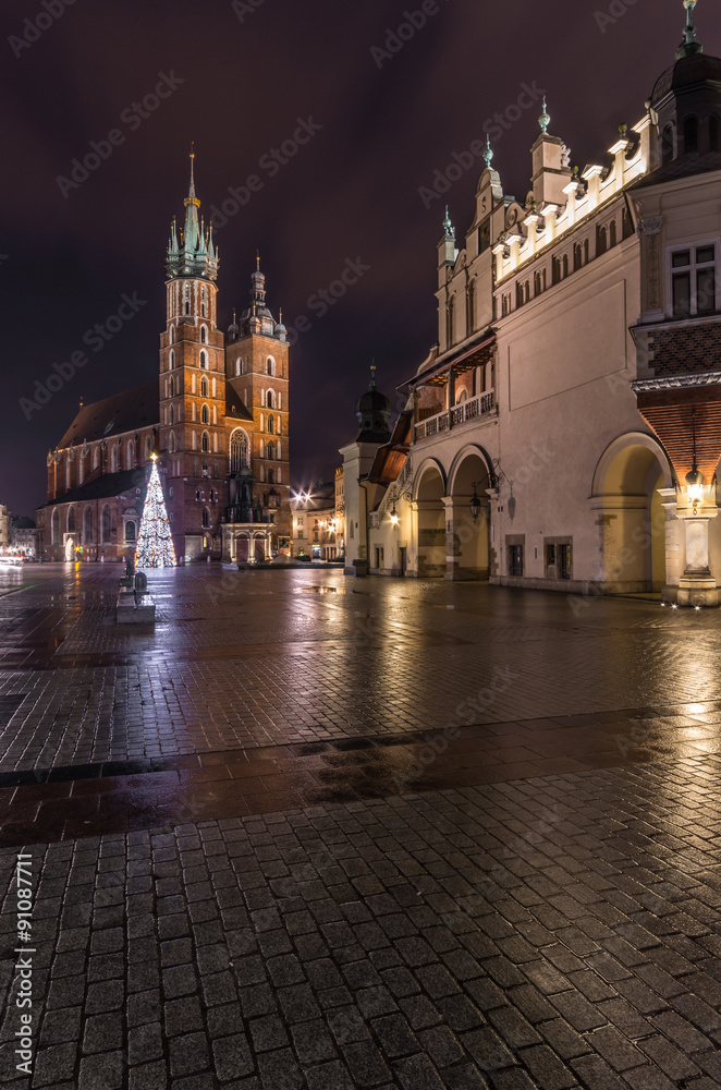 Cloth-hall (Sukiennice) ans St Mary's church in Krakow beautifully illuminated in the night