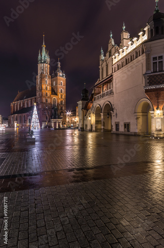 Cloth-hall (Sukiennice) ans St Mary's church in Krakow beautifully illuminated in the night #91087711