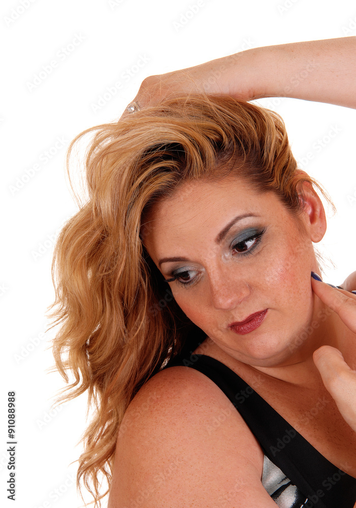 Obraz premium Smiling blond woman with hand on head.