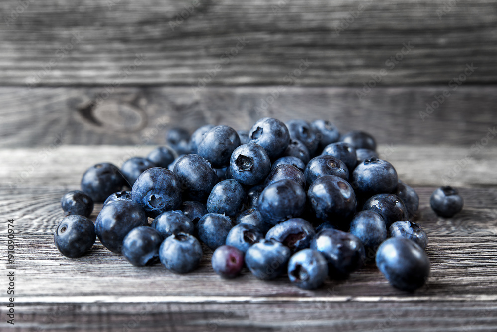 Blueberry lie on wooden background. Rustic cozy background with healthy food. Fresh-gathered berries full of vitamins, good for diet nutrition and healthy meals.