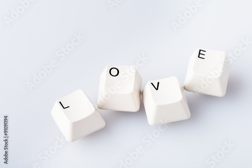 Word LOVE on computer keyboard's buttons. May be used as symbol