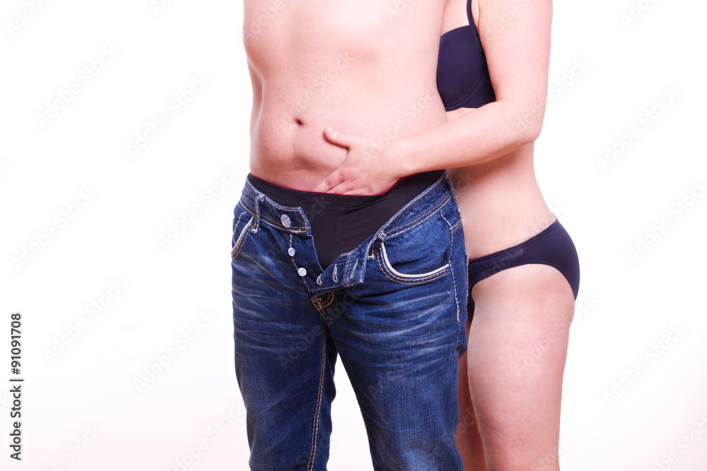 Zärtlich greift die Frau den Mann in die Hose Stock-Foto | Adobe Stock