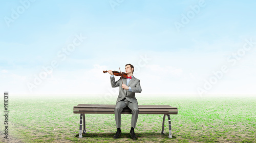 Businessman play violin