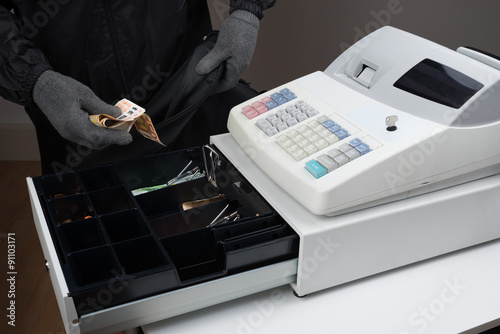 Burglar Stealing Money