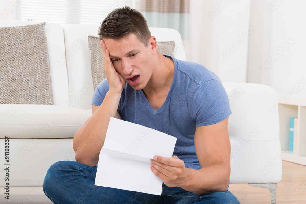 Man Looking At Paper