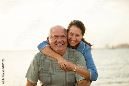  mature couple during sunset.