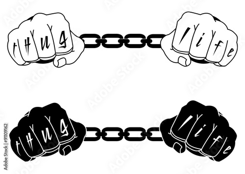 Male hands in steel handcuffs with Thug Life tattoo. Black, whit