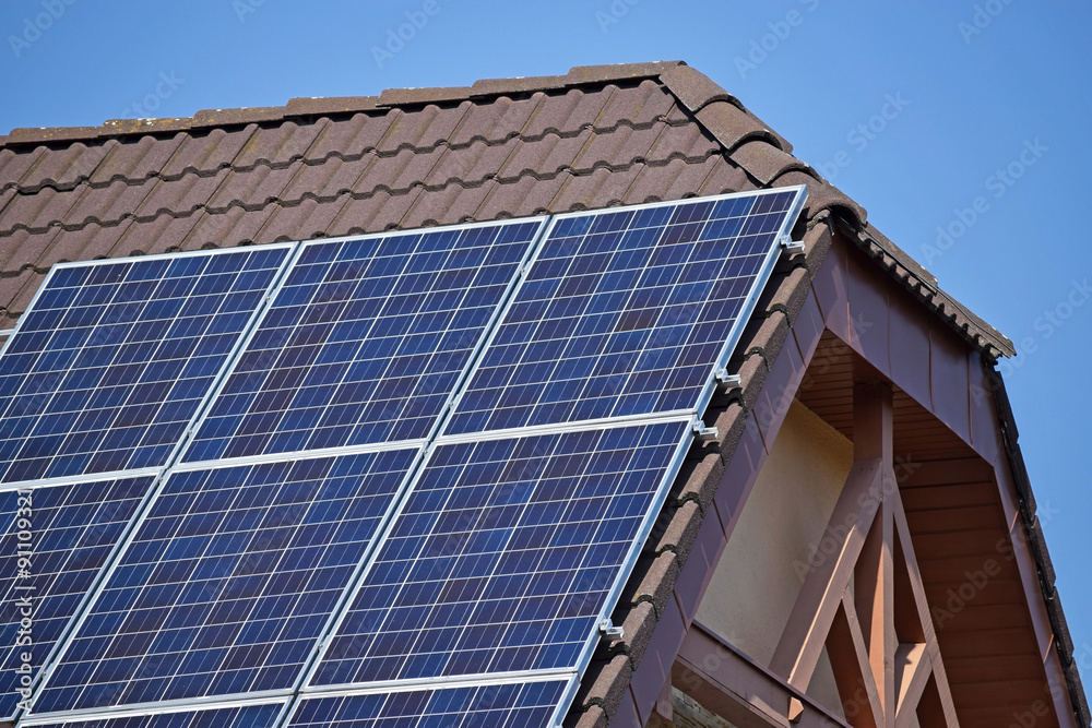 Fototapeta premium Solar panels on the roof of a house