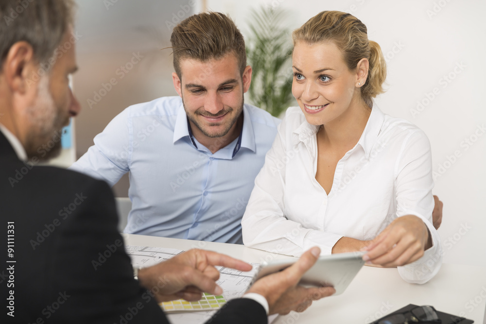young couple meeting architect for the futur house