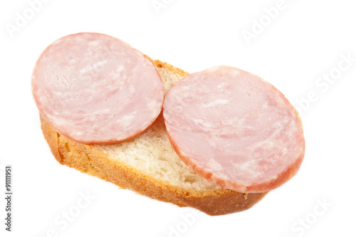 Sandwich with sausage on a white background.