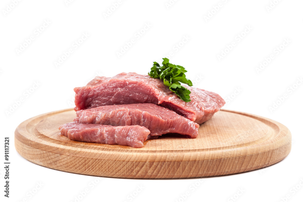 Meat on a cutting board on white background. Meat on a cutting board on white background.