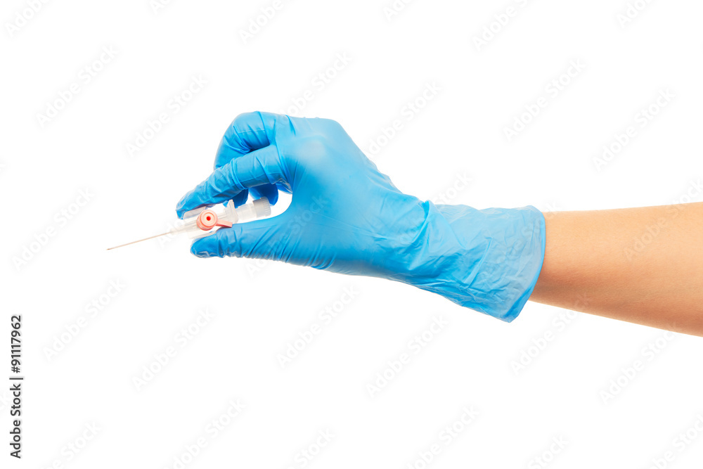 Close up of female doctor's hand in blue sterilized surgical glove with pink plastic catheter against white background Close up of female doctor's hand in blue sterilized surgical glove with pink plastic catheter against white background