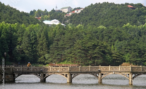 stone bridge on lake in national park of mountain Lu photo