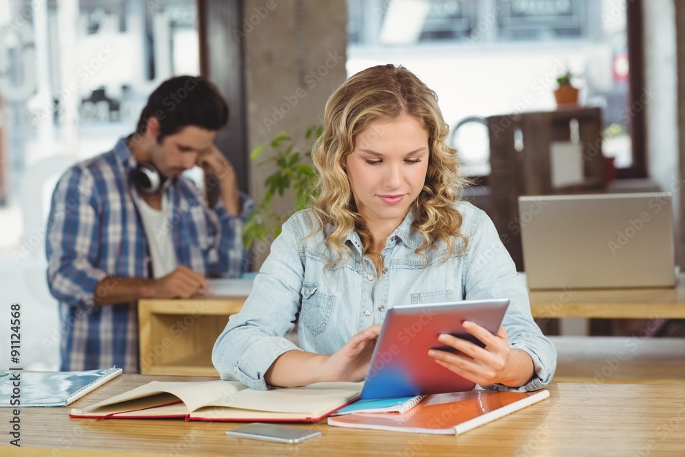 Fototapeta premium Beautiful businesswoman using table in office