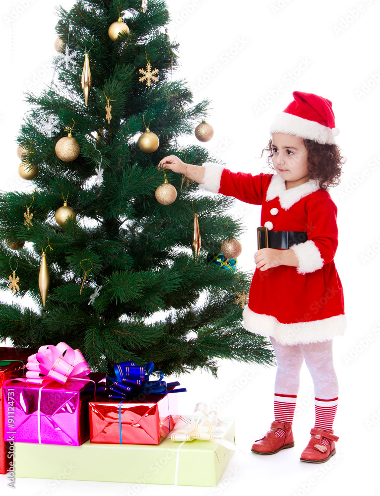 girl decorates the Christmas tree girl decorates the Christmas tree