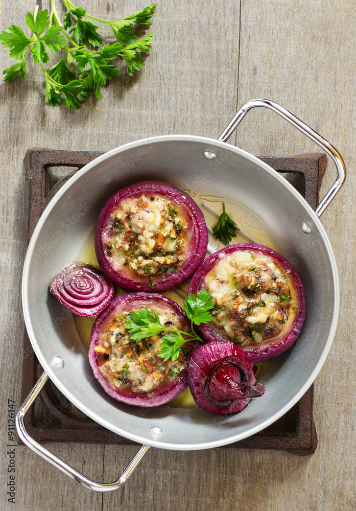 Red onions stuffed with goat cheese and bacon.