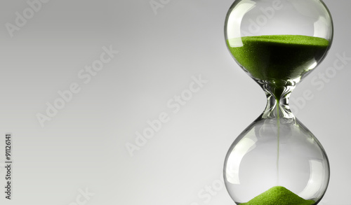 Time passing. Green hourglass.