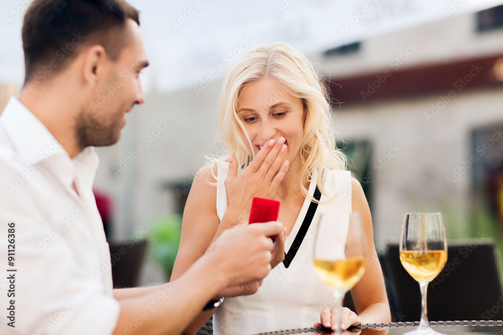 happy couple with engagement ring and wine at cafe happy couple with engagement ring and wine at cafe