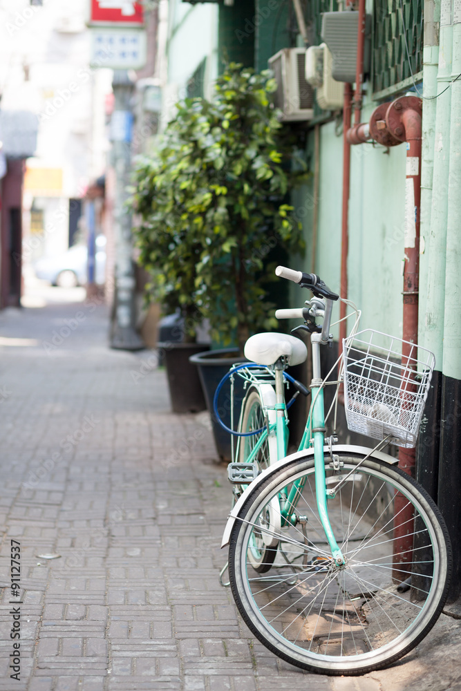 Retro style bicycle at narrow street