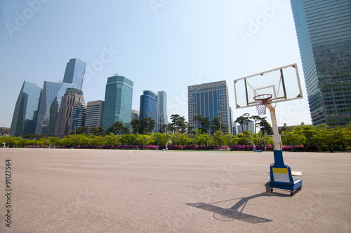 Streetball court in park area near office buildings in Seoul