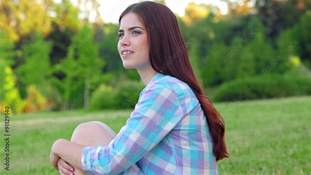 Beautiful girl relaxing in a field Beautiful girl relaxing in a field