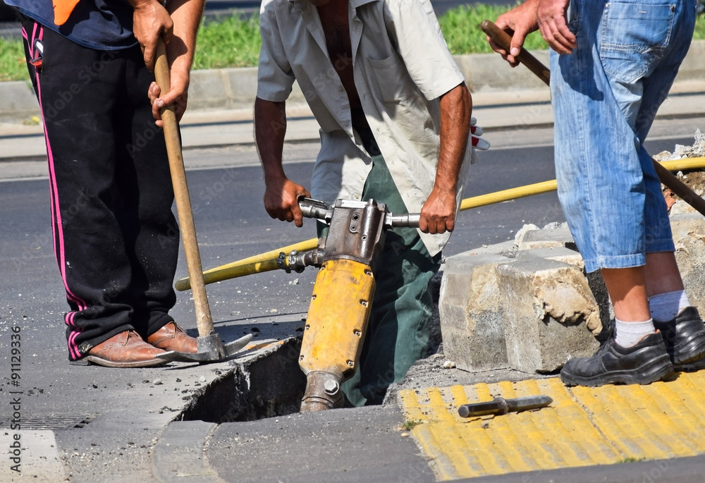 Construction workers with air hammer Construction workers with air hammer