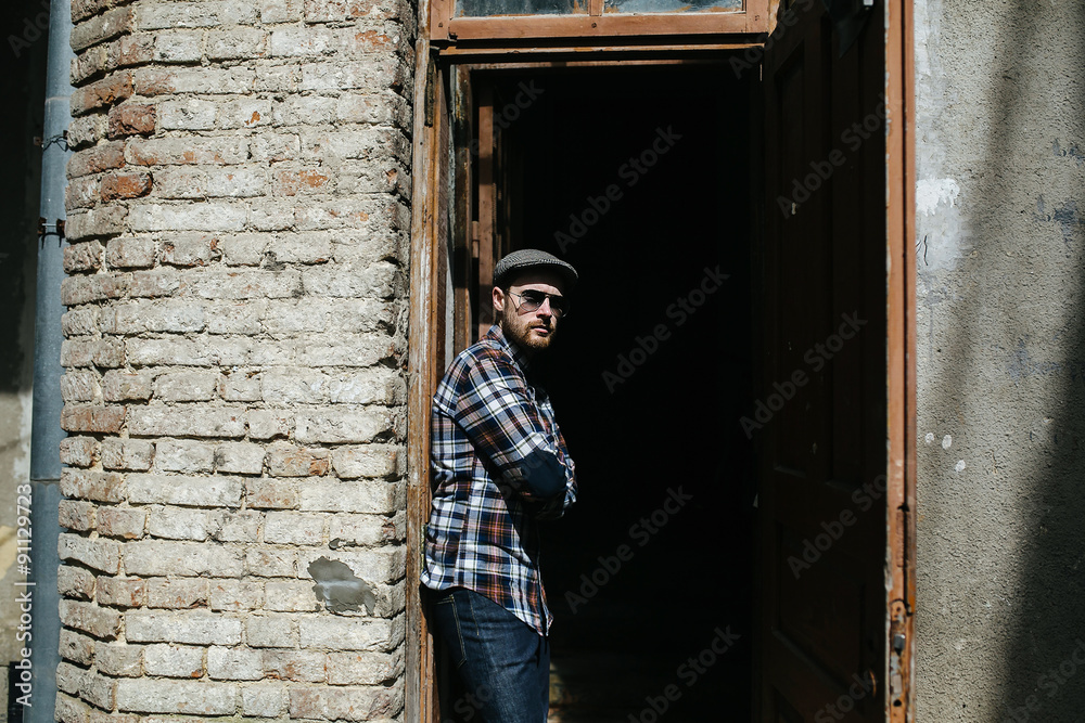 Confident man posing in selvedge jeans Confident man posing in selvedge jeans