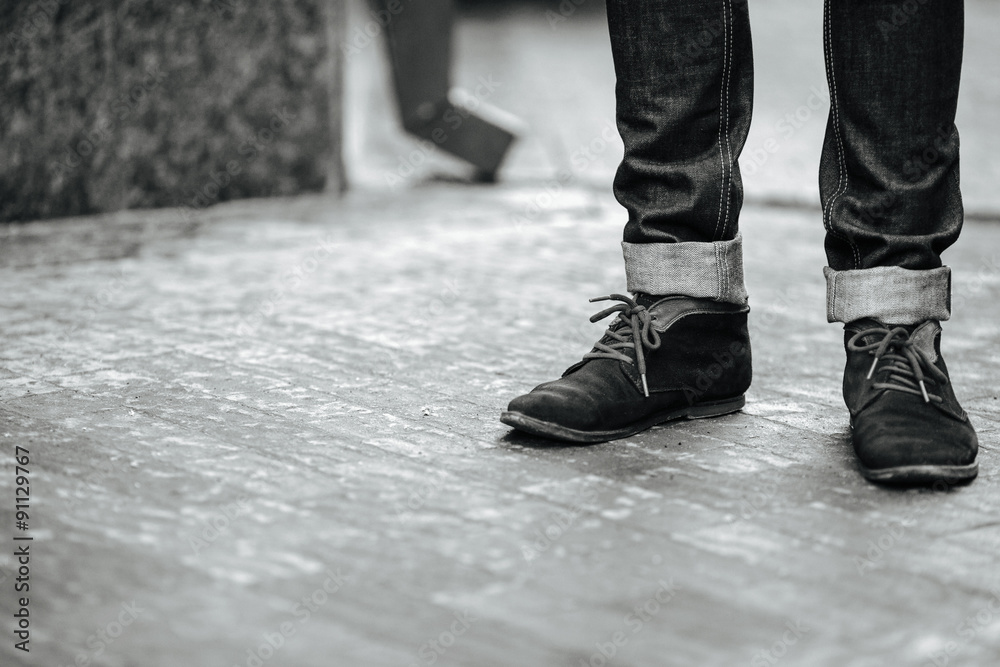 Confident man posing in selvedge jeans Confident man posing in selvedge jeans