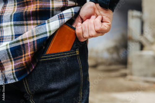 Confident man posing in selvedge jeans