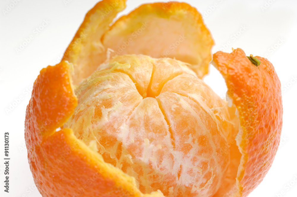 Peeled fruit with orange peel isolated on white Peeled fruit with orange peel isolated on white