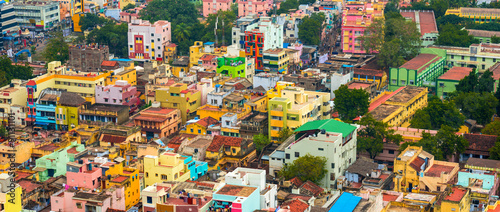 cityscape of colorful homes in crowded Indian city Trichy, panor