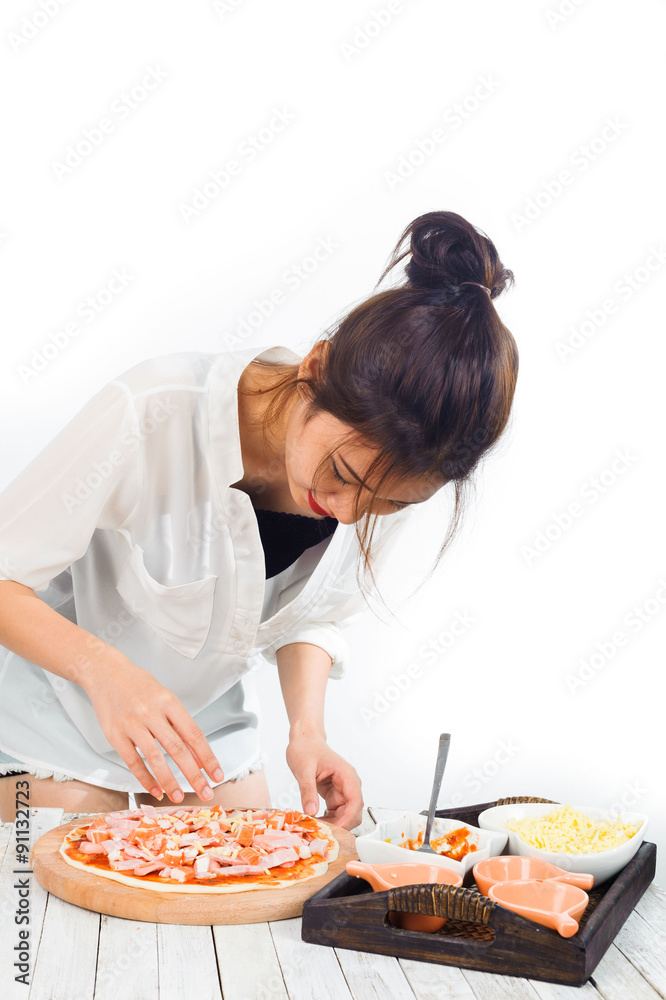 Woman prepareing pizza