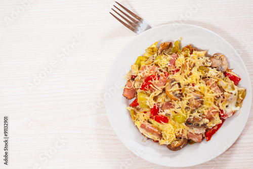 fried eggs with pepper, mushrooms, ham and cheese