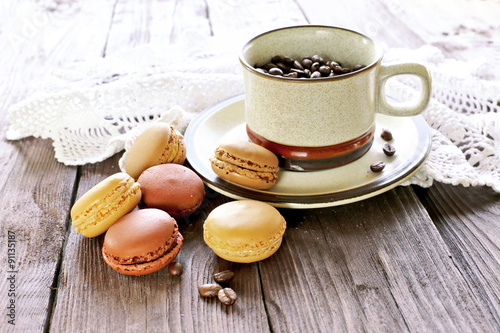 Morning coffee with macaroons on wooden table