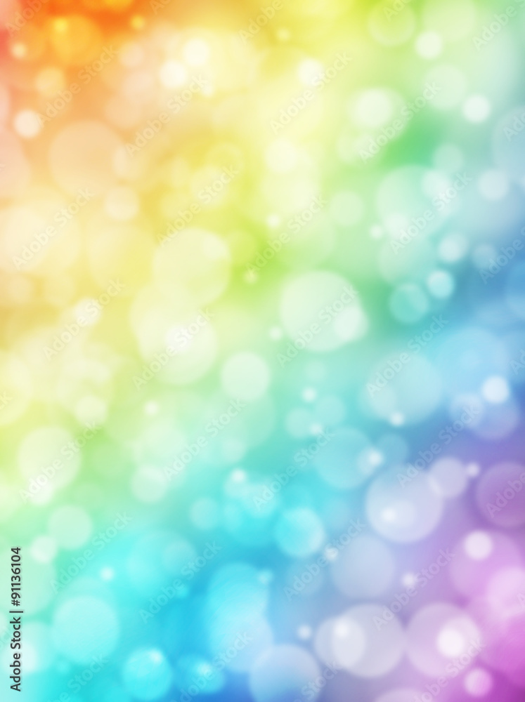 Bokeh background. Rainbow bokeh. Colorful abstract background. Bokeh lights. Defocused lights. Rainbow gradient. Sunlight on decorative vertical texture. Vertical background.