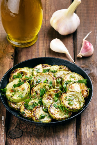 Sauteed zucchinis in frying pan