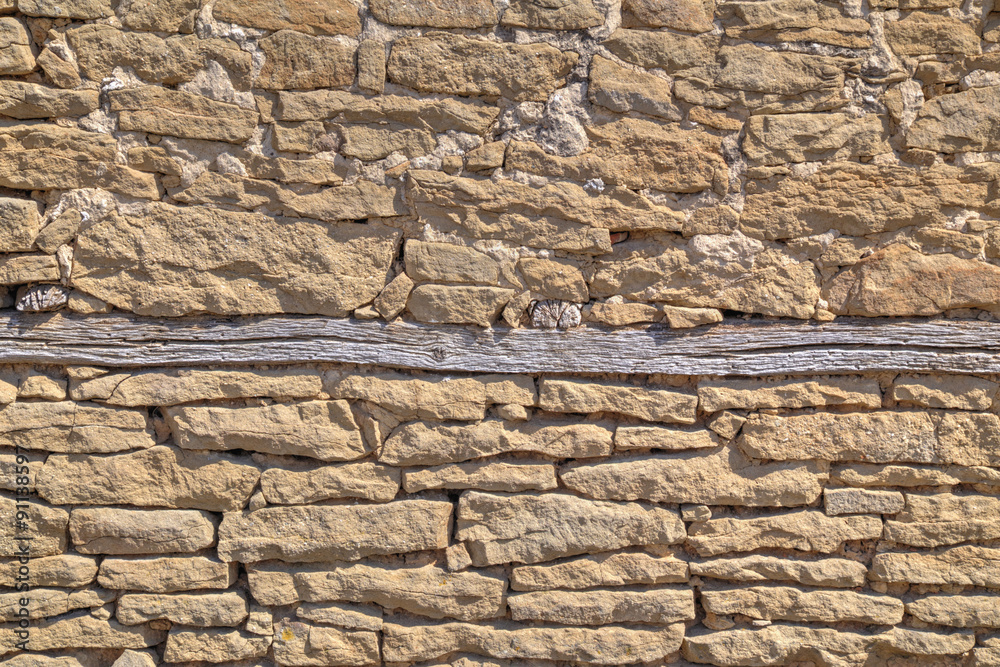 Fototapeta premium Stone wall background with wooden beams