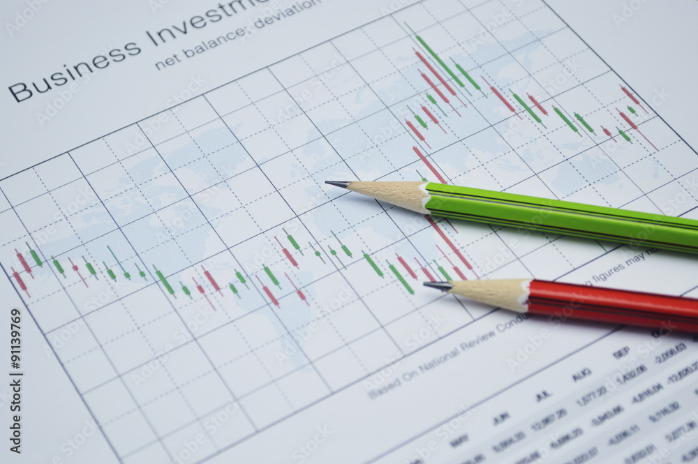 Pencil on business graph, stock market concept Pencil on business graph, stock market concept