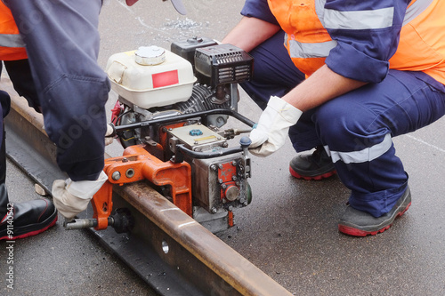 Workers restore the rail