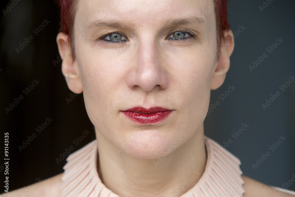 closeup of red-haired woman looking at camera closeup of red-haired woman looking at camera