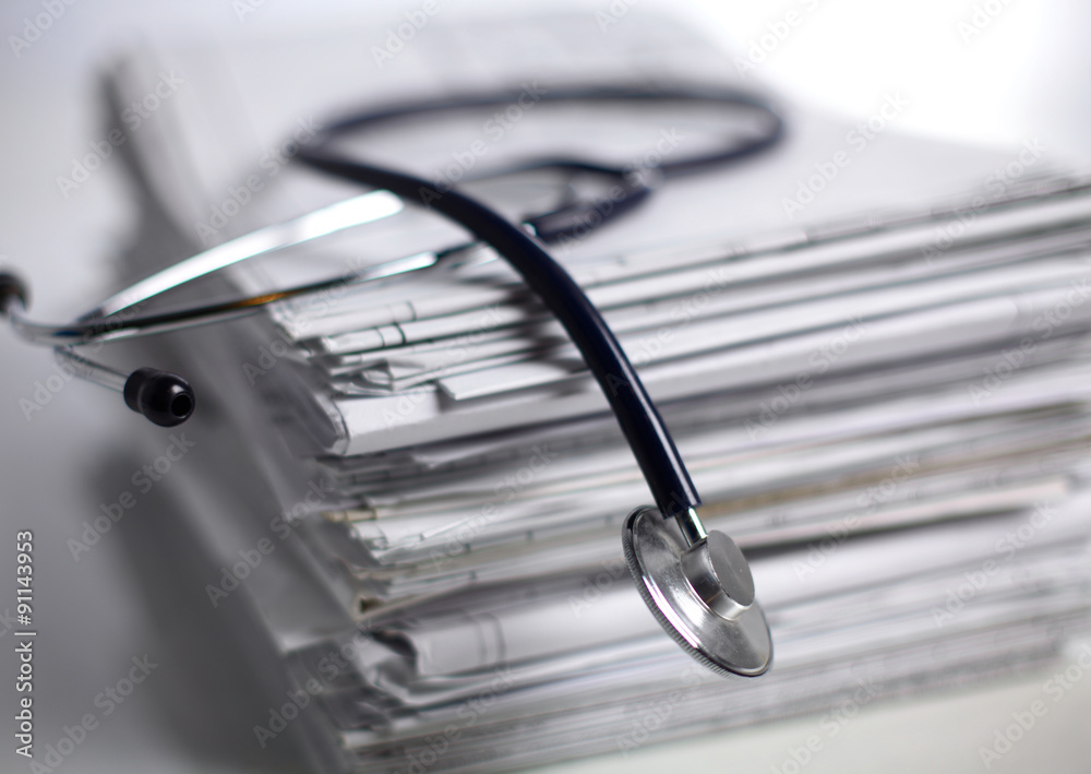 books folder file and stethoscope isolated on white background books folder file and stethoscope isolated on white background