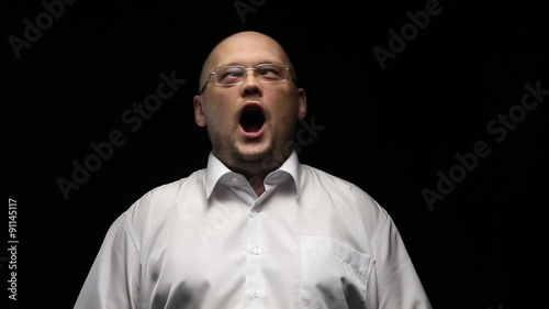 Adult man laughing loudly, wide oen mouth photo