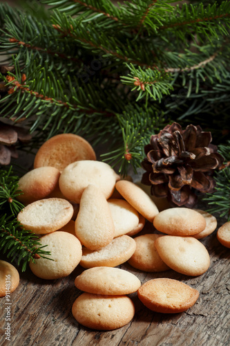 Christmas round gingerbread cookies, cones and spruce branches o