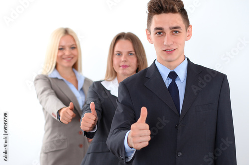 Group of business people, thumbs up